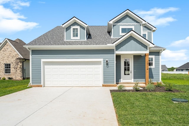 10114 Bighorn Ln, Bell Buckle, TN 37020 - view of front of property featuring a front yard, board and batten siding, a shingled roof, and driveway