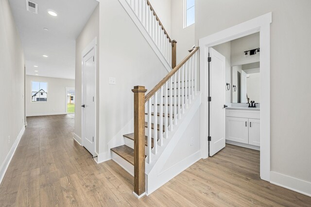10114 Bighorn Ln, Bell Buckle, TN 37020 - stairs with visible vents, wood finished floors, baseboards, and recessed lighting