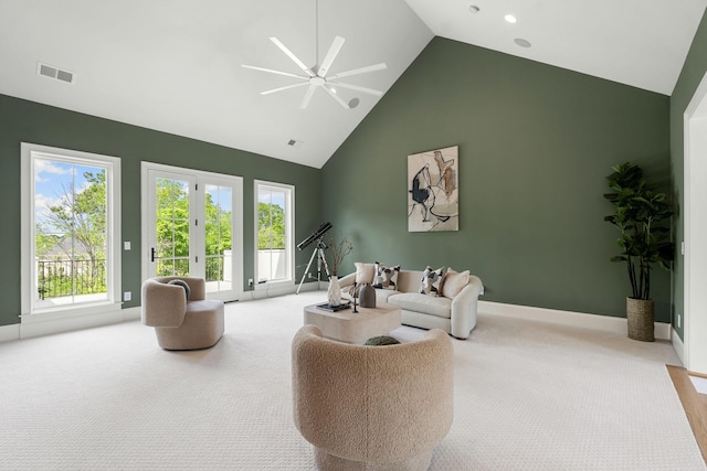 9316 Edenwilde Dr, Brentwood, TN 37027 - living area with light carpet, a ceiling fan, visible vents, and high vaulted ceiling