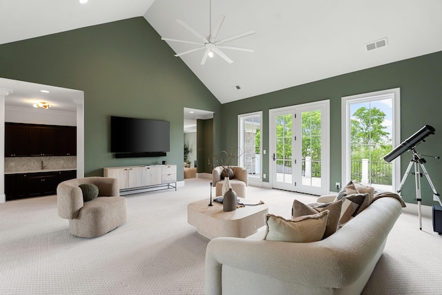 9316 Edenwilde Dr, Brentwood, TN 37027 - living area featuring french doors, light colored carpet, high vaulted ceiling, visible vents, and a ceiling fan