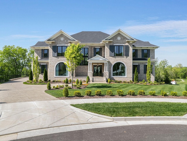 9316 Edenwilde Dr, Brentwood, TN 37027 - view of front facade with a front lawn, french doors, and brick siding