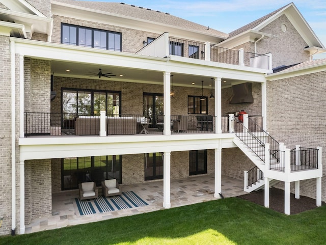 9316 Edenwilde Dr, Brentwood, TN 37027 - rear view of house featuring a balcony, a ceiling fan, brick siding, a patio, and stairs