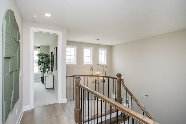 5963 Hunt Valley Dr, Spring Hill, TN 37174 - hall with an upstairs landing, wood finished floors, a chandelier, baseboards, and recessed lighting