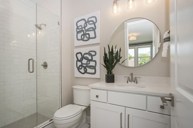 5963 Hunt Valley Dr, Spring Hill, TN 37174 - bathroom featuring a shower stall, toilet, and vanity