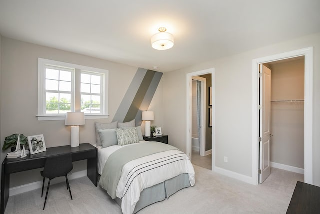 5963 Hunt Valley Dr, Spring Hill, TN 37174 - bedroom featuring baseboards, a spacious closet, light colored carpet, ensuite bath, and a closet