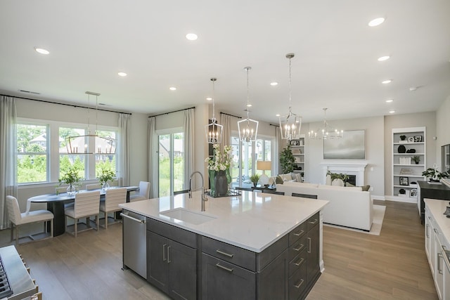 5963 Hunt Valley Dr, Spring Hill, TN 37174 - kitchen featuring a chandelier, a sink, light wood-style flooring, recessed lighting, and open floor plan