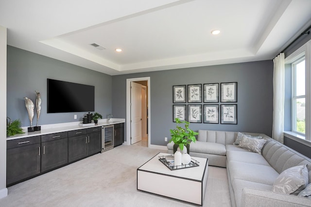 5963 Hunt Valley Dr, Spring Hill, TN 37174 - living room featuring wine cooler, a tray ceiling, plenty of natural light, and recessed lighting