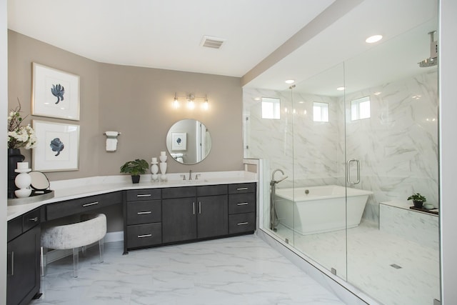 5963 Hunt Valley Dr, Spring Hill, TN 37174 - bathroom with marble look tiles, a marble finish shower, a soaking tub, and vanity