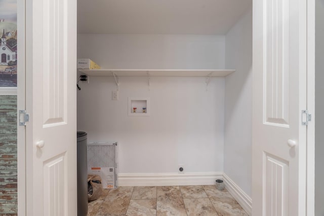 laundry area featuring laundry area, hookup for an electric dryer, washer hookup, and baseboards