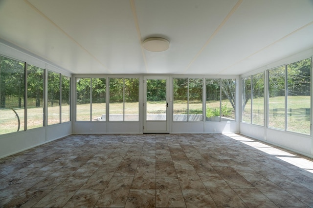 unfurnished sunroom with plenty of natural light and french doors