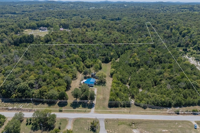 drone / aerial view with a mountain view and a forest view