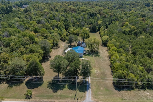drone / aerial view featuring a forest view