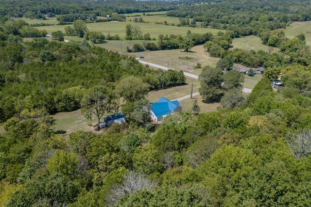 bird's eye view with a rural view and a view of trees
