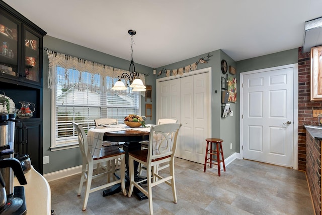 dining area featuring baseboards