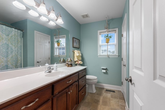 bathroom with toilet, visible vents, baseboards, and vanity