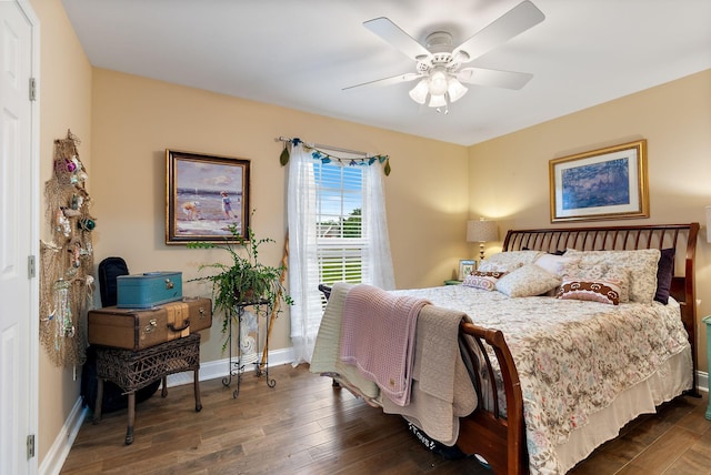 bedroom with baseboards, a ceiling fan, and wood finished floors