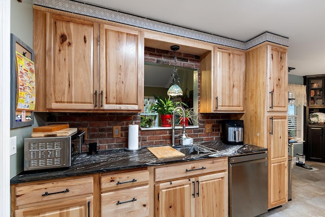 kitchen with a sink, light brown cabinets, tasteful backsplash, and dishwasher