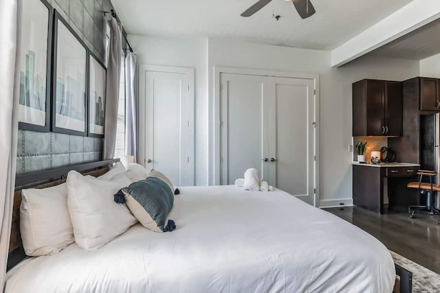 210 30th Ave N Unit 207, Nashville, TN 37203 - bedroom with dark wood-style flooring, a closet, a ceiling fan, and multiple windows