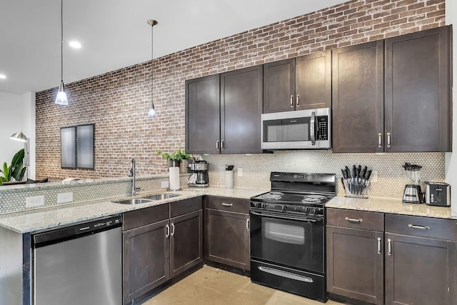 210 30th Ave N Unit 207, Nashville, TN 37203 - kitchen featuring a sink, a peninsula, stainless steel appliances, and backsplash