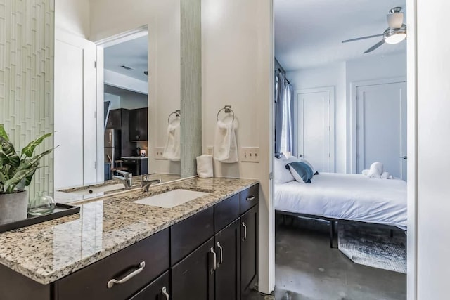210 30th Ave N Unit 207, Nashville, TN 37203 - bathroom with vanity, ensuite bath, visible vents, and a ceiling fan