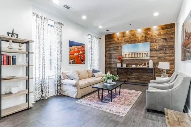 210 30th Ave N Unit 207, Nashville, TN 37203 - living room featuring wood walls, recessed lighting, visible vents, and wood finished floors