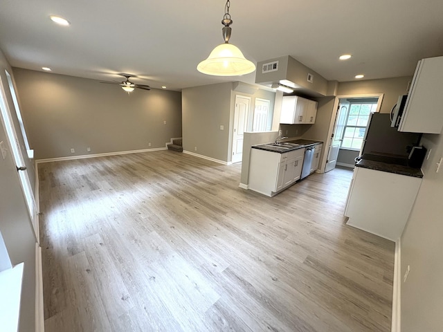 kitchen featuring dishwasher, white cabinetry, ceiling fan, dark countertops, and recessed lighting