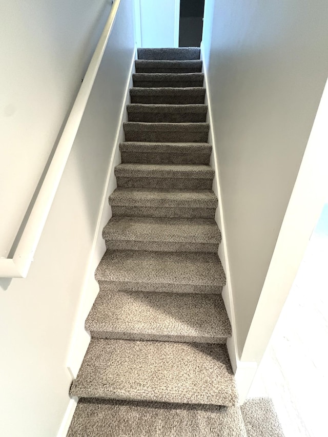 stairway with baseboards