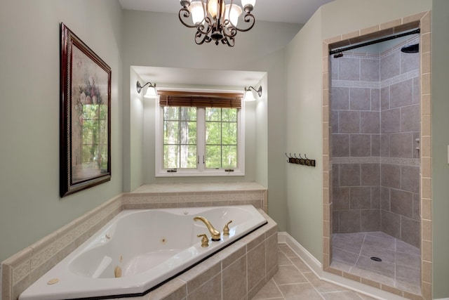 full bath featuring tile patterned floors, a chandelier, a whirlpool tub, and a tile shower