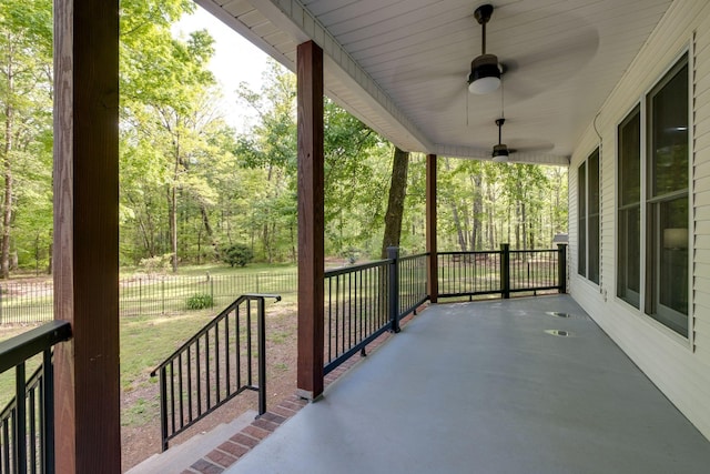 view of patio featuring ceiling fan and fence
