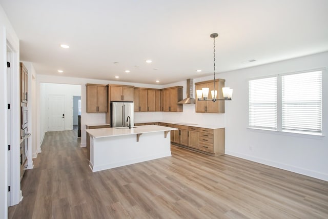 126 W Cassa Way, Mount Juliet, TN 37122 - kitchen featuring wall chimney exhaust hood, stainless steel appliances, brown cabinets, and a sink