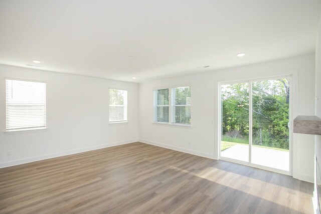 126 W Cassa Way, Mount Juliet, TN 37122 - empty room with light wood-style flooring, baseboards, and recessed lighting