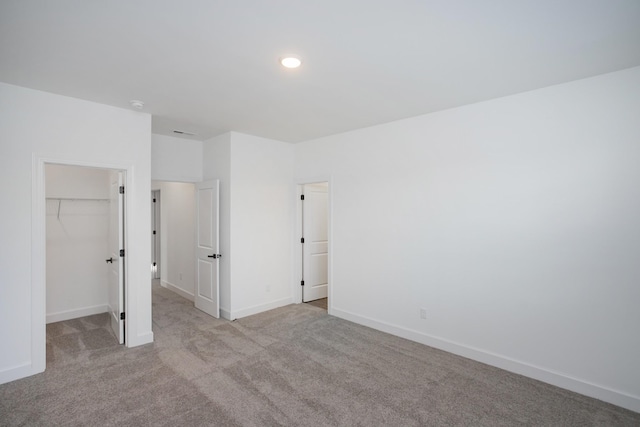 126 W Cassa Way, Mount Juliet, TN 37122 - unfurnished bedroom featuring carpet, a closet, baseboards, and a spacious closet