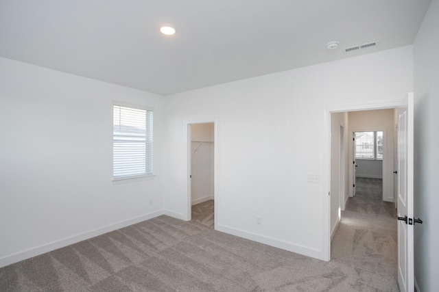 126 W Cassa Way, Mount Juliet, TN 37122 - unfurnished bedroom with visible vents, baseboards, light colored carpet, a spacious closet, and recessed lighting