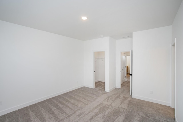 126 W Cassa Way, Mount Juliet, TN 37122 - unfurnished bedroom with a closet, recessed lighting, baseboards, a spacious closet, and light carpet