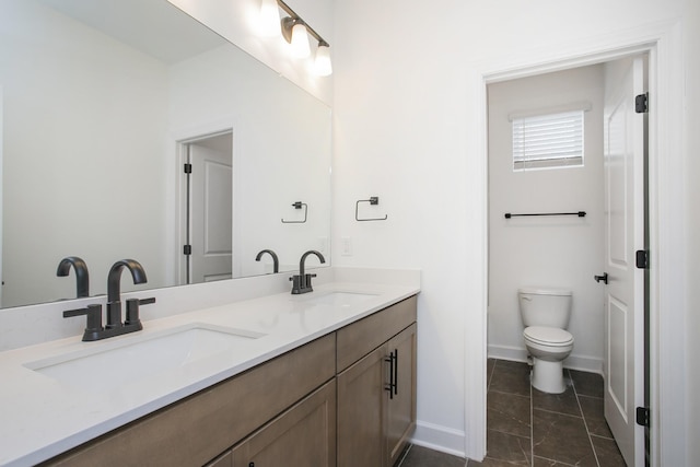 126 W Cassa Way, Mount Juliet, TN 37122 - bathroom featuring double vanity, toilet, baseboards, and a sink