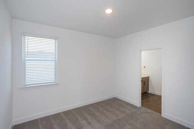 132 W Cassa Way, Mount Juliet, TN 37122 - spare room featuring baseboards, dark carpet, recessed lighting, and a wealth of natural light