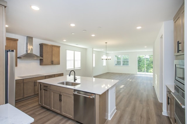132 W Cassa Way, Mount Juliet, TN 37122 - kitchen featuring a chandelier, wall chimney range hood, appliances with stainless steel finishes, and plenty of natural light