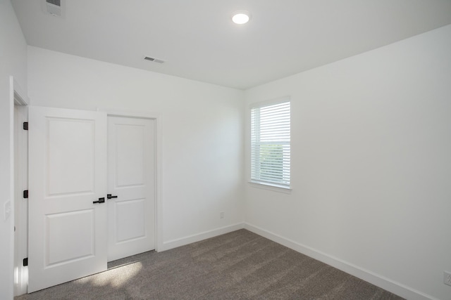 132 W Cassa Way, Mount Juliet, TN 37122 - unfurnished bedroom with a closet, visible vents, baseboards, and dark carpet