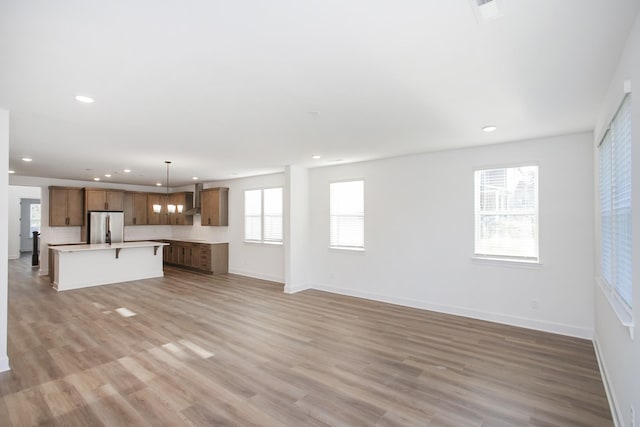 132 W Cassa Way, Mount Juliet, TN 37122 - unfurnished living room featuring light wood finished floors, baseboards, and recessed lighting