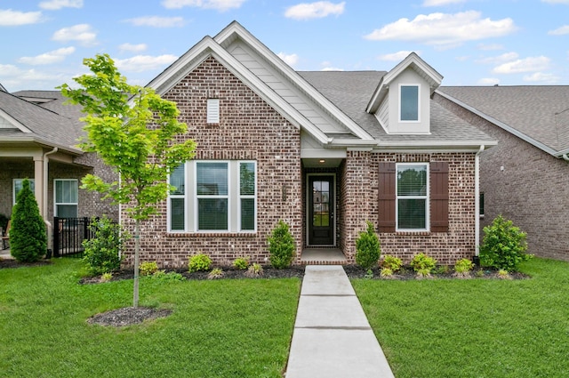 2131 Gunwale Mews, Franklin, TN 37064 - view of front of property featuring brick siding, a front lawn, and a shingled roof