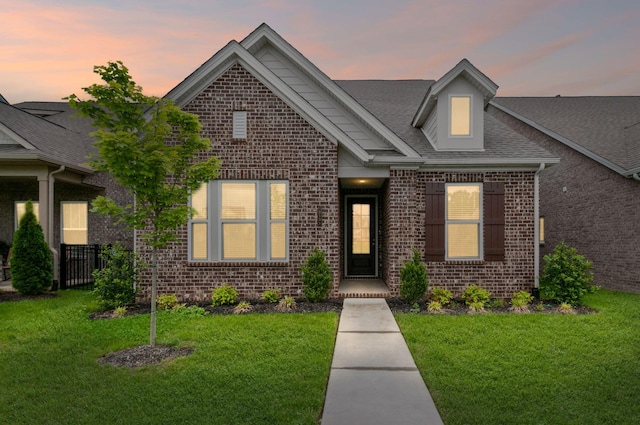 2131 Gunwale Mews, Franklin, TN 37064 - view of front facade featuring brick siding, a front yard, and roof with shingles