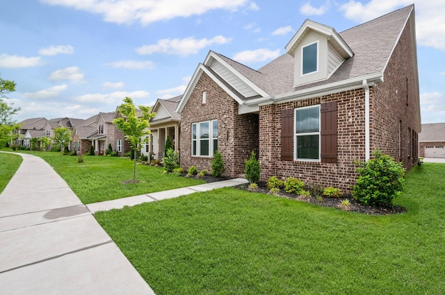 2131 Gunwale Mews, Franklin, TN 37064 - view of front facade with brick siding, a front lawn, roof with shingles, and a residential view