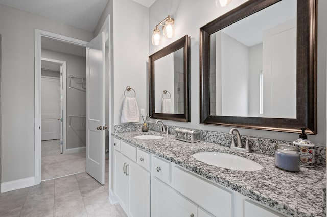2131 Gunwale Mews, Franklin, TN 37064 - bathroom with baseboards, double vanity, and a spacious closet
