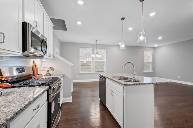 2131 Gunwale Mews, Franklin, TN 37064 - kitchen with appliances with stainless steel finishes, a sink, baseboards, dark wood-type flooring, and recessed lighting