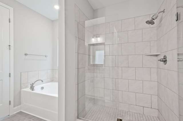 2131 Gunwale Mews, Franklin, TN 37064 - full bathroom featuring a stall shower, a bath, and baseboards