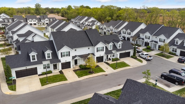 birds eye view of property with a residential view