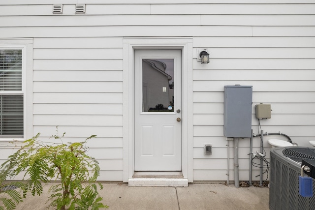 entrance to property with central AC unit