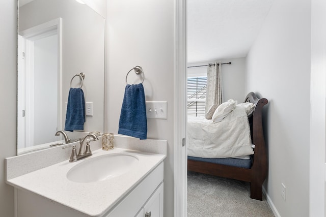ensuite bathroom featuring vanity and connected bathroom