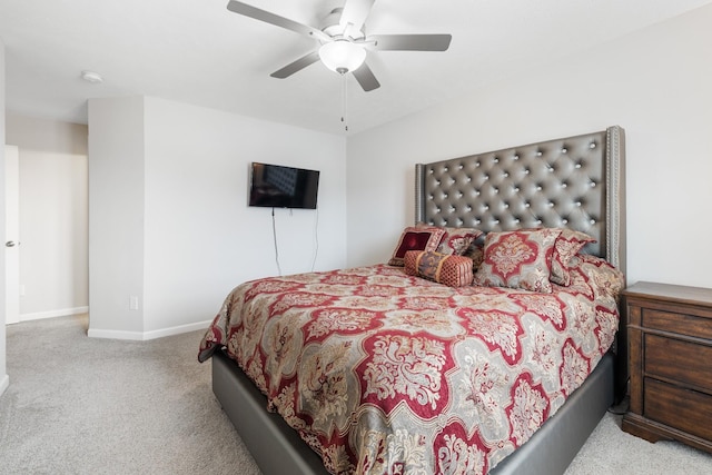 carpeted bedroom with baseboards and ceiling fan