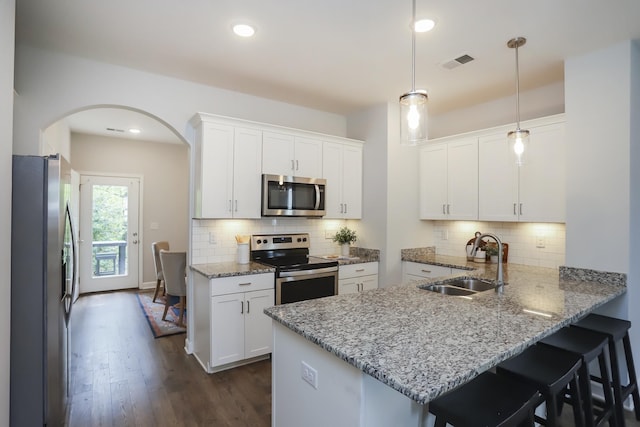 2804 Sonoma Way, Columbia, TN 38401 - kitchen with a sink, stainless steel appliances, visible vents, arched walkways, and white cabinets